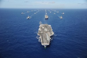 The aircraft carrier USS Ronald Reagan (CVN 76) leads a multinational formation of ships at sea in the Pacific Ocean during the biennial maritime interoperability exercise Rim of the Pacific 2010. Participating nations include the Republic of Korea, Taiwan, Japan, Singapore, France, Canada, Australia and the United States. (U.S. Navy photo by Mass Communication Specialist 1st Class Scott Taylor/Released)