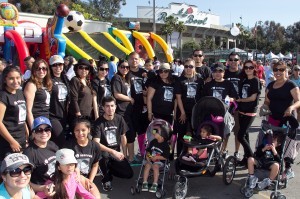 A team gathers for a group photo during Los Angeles Walk Now for Autism Speaks on Saturday, April 20, 2013 at the Rose Bowl in Pasadena. The 2013 LA Autism Walk hosted 40,000 attendees, raised over $1.8M for autism and is the largest autism walk in the country. Photo by Rex Sanchez