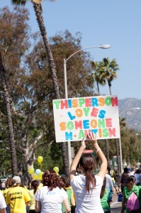 A walker shows her autism support with a homemade sign during Los Angeles Walk Now for Autism Speaks on Saturday, April 20, 2013 at the Rose Bowl in Pasadena. The 2013 LA Autism Walk hosted 40,000 attendees, raised over $1.8M for autism and is the largest autism walk in the country. Photo by Teresa Yu