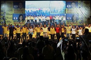 President Benigno S. Aquino III raises the hands of Team PNoy during the Miting de Avance of the Liberal Party (LP) – Quezon City Chapter at the Amoranto Sports Complex in Barangay Paligsahan, Quezon City on Friday (May 10, 2013). Team PNoy includes Aurora Lone District Representative Juan Edgardo “Sonny” Angara, former National Youth Commission (NYC) chairperson Paolo Benigno “Bam” Aquino IV, former Akbayan Partylist Representative Ana Theresia “Risa” Hontiveros-Baraquel, Senators Alan Peter “Compañero” Cayetano and Francis Joseph “Chiz” Escudero, former Movie and Television Review and Classification Board (MTRCB) chairperson Mary Grace Poe-Llamanzares, Senator Loren Legarda, former Senators Maria Ana Consuelo “Jamby” Madrigal and Ramon Magsaysay, Jr., Senators Aquilino Martin “Koko” Pimentel III and Antonio “Sonny” Trillanes IV, and former Las Piñas Representative Cynthia Villar. (MNS photo)