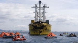 Rescuers search for survivors and bodies near a cargo vessel, which collided with a ferry on Friday, in Talisay, Cebu, August 17, 2013. (photo courtesy of www.voanews.com)