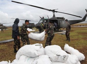 CHOPPER LOADING:Food packs for the victims and other relief goods are loaded into the airforce chopper to be distributed to Santa Fe in Tacloban City, Leyte to the urban area affected by the super typhoon Yolanda, Saturday (November 16). (MNS photo)