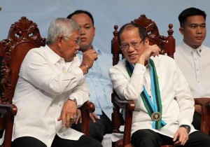 President Benigno S. Aquino III converses with Defense Secretary Voltaire Gazmin during the Joint Graduation of the Major Services Pre-Entry Officer Courses at the Camp General Emilio Aguinaldo in Quezon City on Monday (November 25, 2013). (MNS photo)