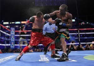 Undefeated Jamaican Nicholas Walters delivers a searing blow to Filipino star Nonito Donaire on his way to knocking out the Filipino champion with one second remaining in the sixth round Saturday to win the World Boxing Association featherweight title.Photo: Chris Farina/Top Rank