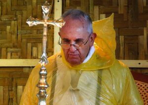 Pope Francis, in a rain poncho, officiates a Mass in Tacloban Airport upon his arrival on Saturday, January 17. Rain greeted the Pope when he arrived in the city to console the survivors of super typhoon Yolanda, the country's worst natural disaster that killed several thousands more than a year ago. (MNS photo)