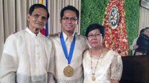 Presidential Award winner Roderick Dela Cruz, pictured here with his parents, is a senior engineer with Southern California Edison.