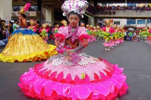 Young girls in floral costumes dance at the opening parade of the month-long Panagbenga Festival celebration Sunday. Students from 12 elementary schools in Benguet competed during the elimination round for a chance to participate in the main Street Dancing Competition on February 28. (MNS photo)
