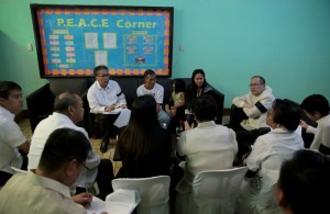 President Benigno S. Aquino III condoles with the family of the fallen Philippine National Police-Special Action Force (PNP-SAF) Troopers during the Necrological Service at the NCRPO Multi-Purpose Center of Camp Bagong Diwa in Bicutan, Taguig City on Friday (January 30). (MNS photo)