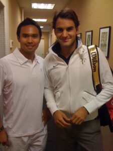 Dante Sta. Cruz, a former junior, division tennis star in the Philippines whose performance in the grand slam events in 1994 – 1996 earned him some offers to come to the United States, with his idol, Roger Federer.