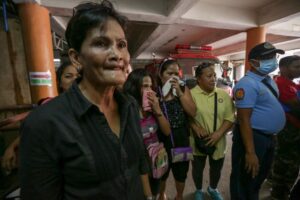 Relatives of victims of a fire that gutted a footwear factory in Valenzuela City arrive at the town hall of Barangay Ugong in Valenzuela City on Thursday to identify the remains of their loved ones. 72 people died in the fire, most of whom workers who were trapped inside the burning factory.(MNS Photo)