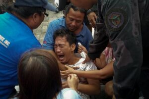 -- A survivor of passenger ferry M/V Kim Nirvana, that capsized near the shore in Ormoc, Leyte, cries after being rescued Thursday. At least 36 people were killed after the passenger ferry bound for Camotes Islands with close to 173 people on board capsized 200 meters from the shore.(MNS photo)