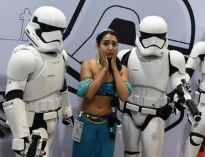 A fan in costume poses with Stormtroopers at a Star Wars display during the Disney D23 EXPO 2015 held at the Anaheim Convention Center in Anaheim, California on August 14, 2015 (AFP Photo/Mark Ralston)