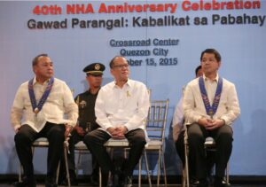 President Benigno S. Aquino III graces the 40th National Housing Authority (NHA) anniversary and “Gawad Parangal Sa Kabalikat Sa Pabahay” awarding ceremony at the Convenarium, Crossroad Center in Barangay Paligsahan , Quezon City, Thursday, October 15, 2015. The National Housing Authority (NHA) celebrates its 40 years of providing housing services to the homeless and underprivileged Filipino families. The event also calls for appropriate recognition of the contributions of its partner-communities and agencies through “Gawad Parangal Kabalikat Sa Pabahay. Also in photo are HUDCC Chairperson Chito Cruz and NHA General Manager Sinforoso Pagunsan. (MNS photo)