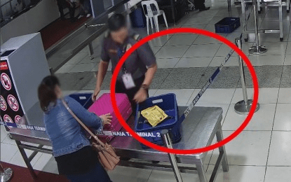 NAIA screener axed for getting chocolates from passenger’s luggage